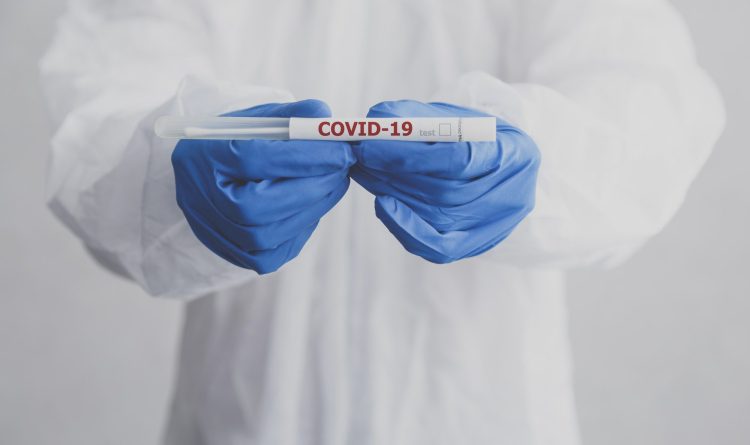 Laboratory technician hold coronavirus test tube for COVID-19 test